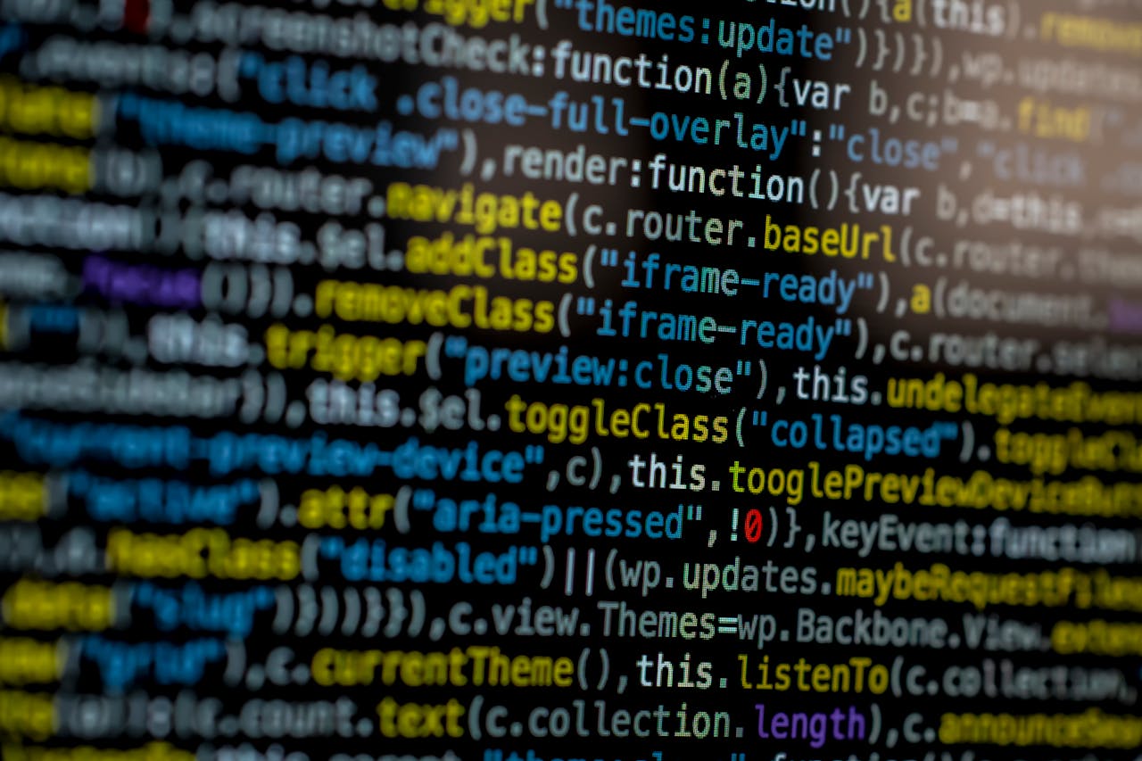about-me-02 An extreme close-up of colorful programming code on a computer screen, showcasing development and software debugging.